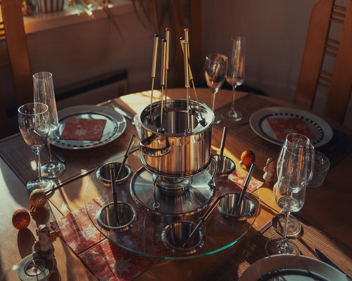 Colombian family gathering around a table with domestic food